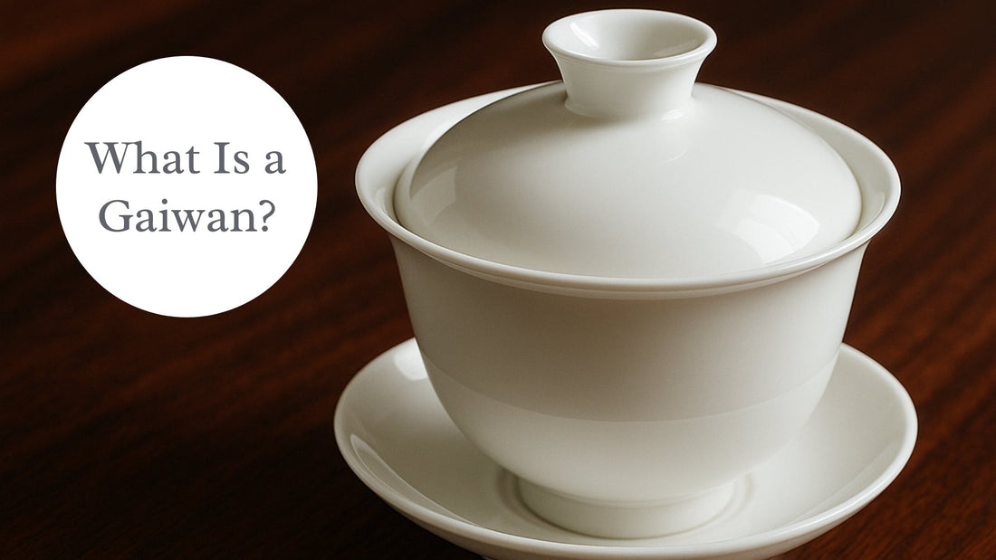 a white gaiwan on a wood table