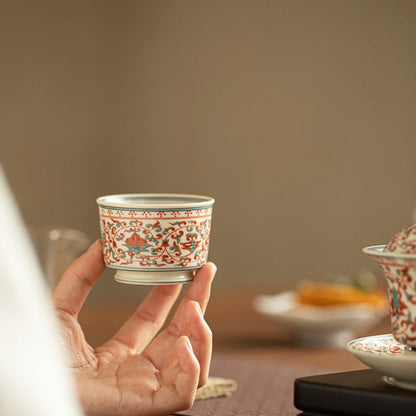 holding a chinese tea cup 