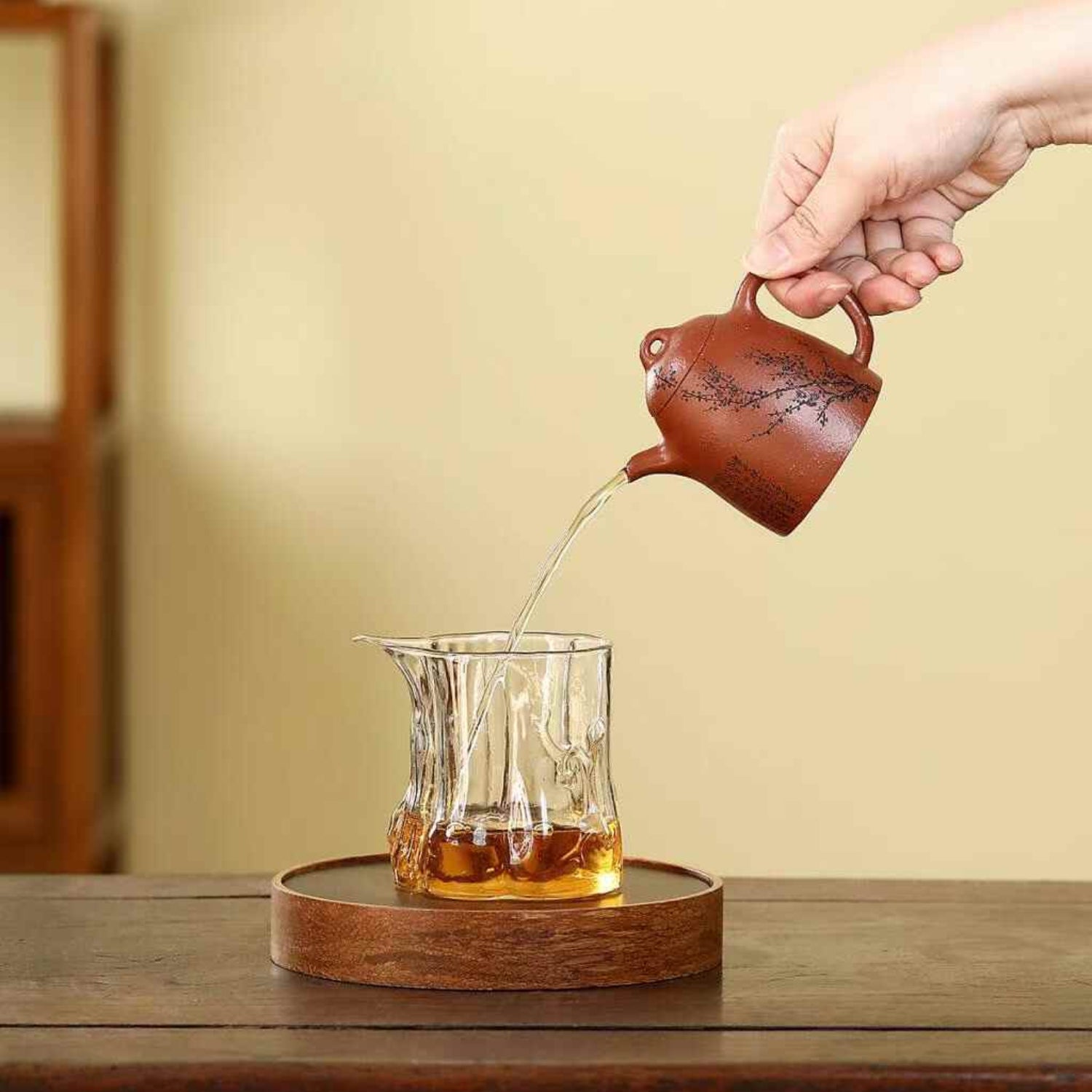 pouring tea with a Qin Quan shape Yixing Teapot