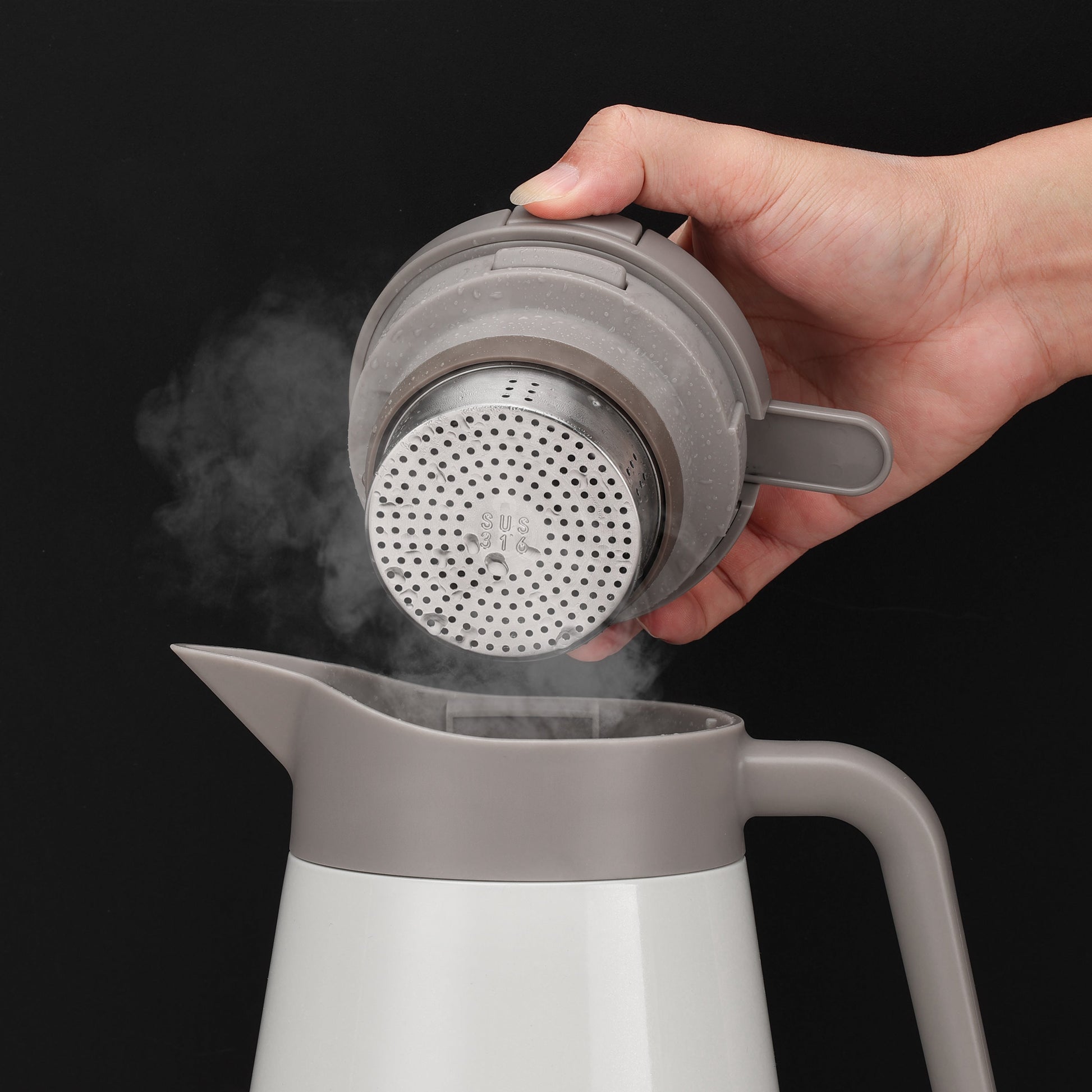 steam coming out from a thermos jug