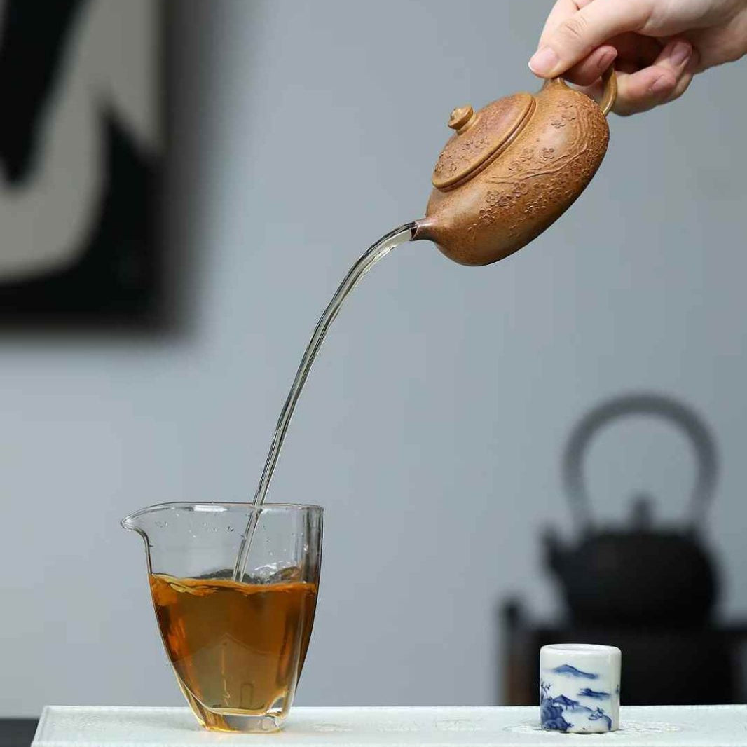 yixing teapot pouring tea