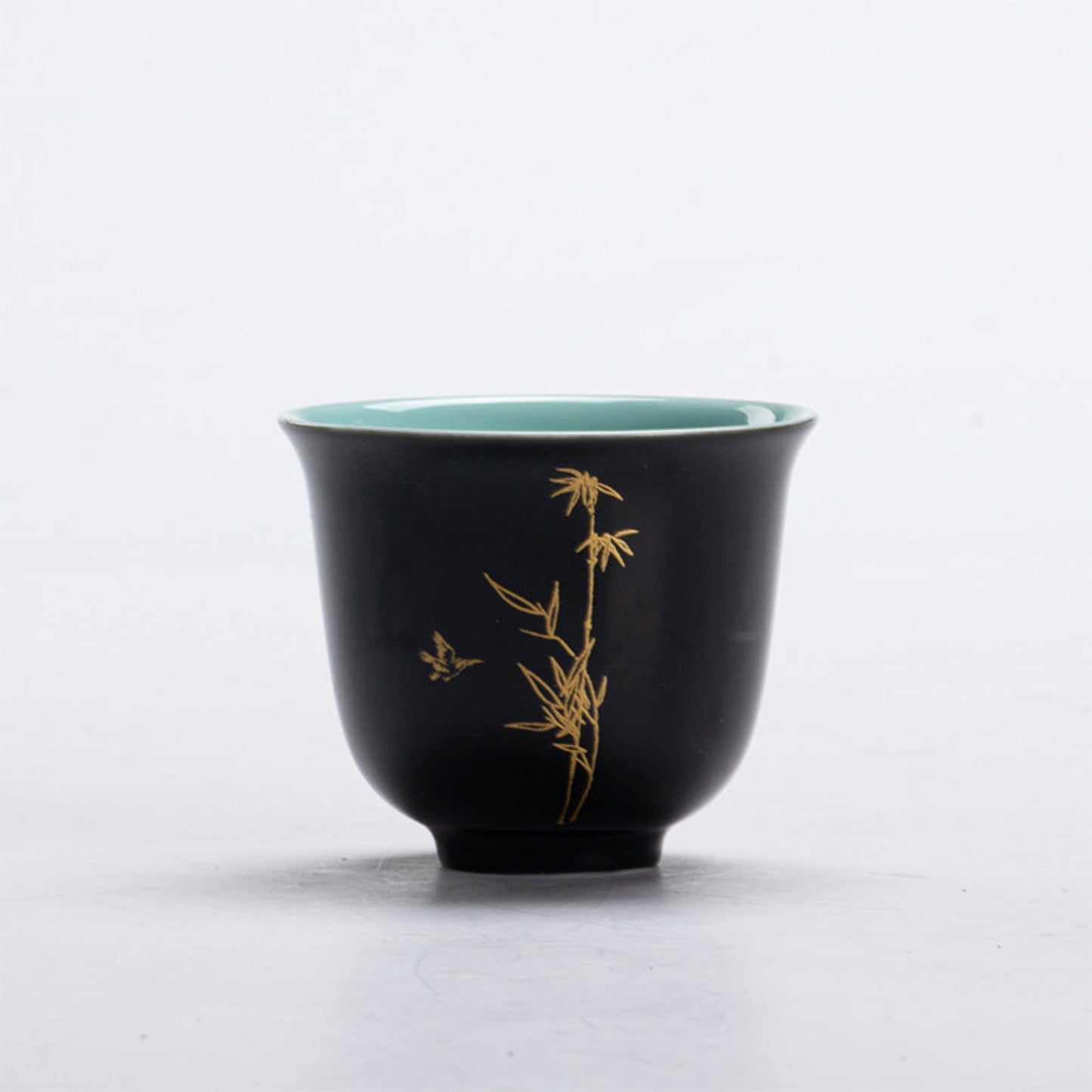 black Chinese tea cup with bamboo motif