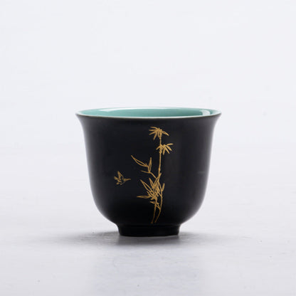 black Chinese tea cup with bamboo motif