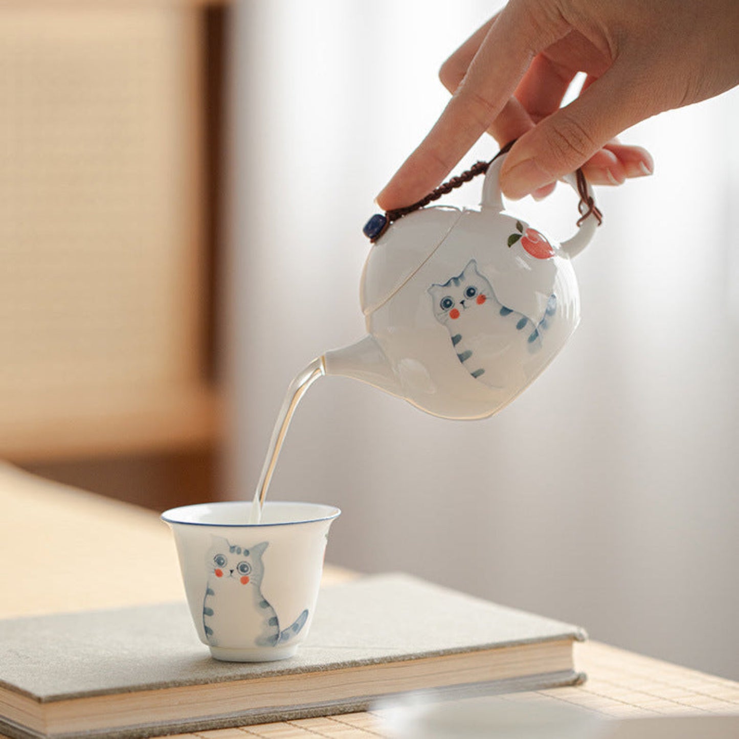 pouring tea from a gongfu teapot 