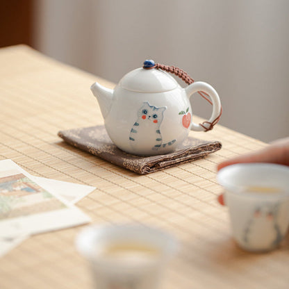 close up of cute cate white teapot