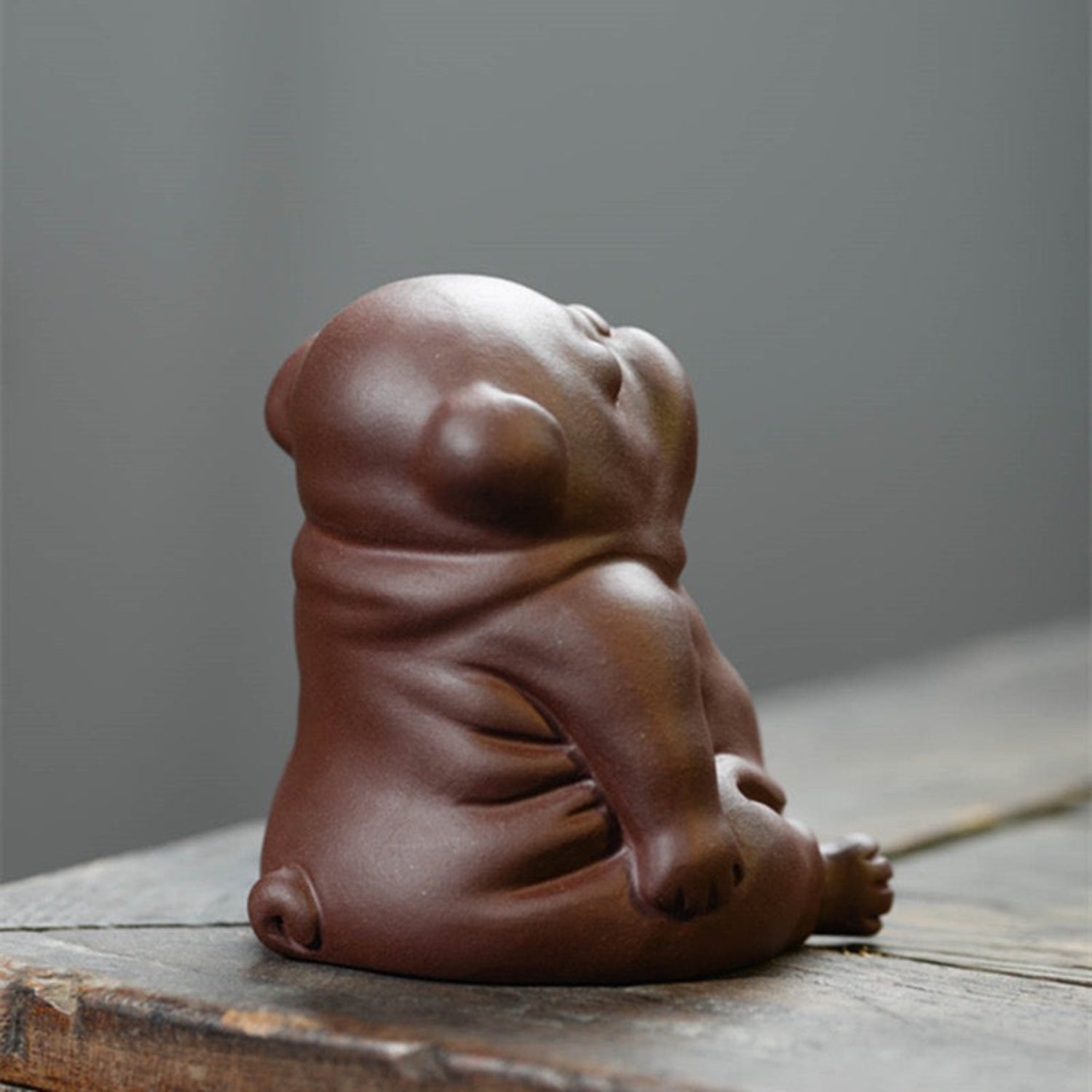 lazy dog clay figurine