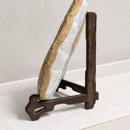 tea cake on a wooden display stand