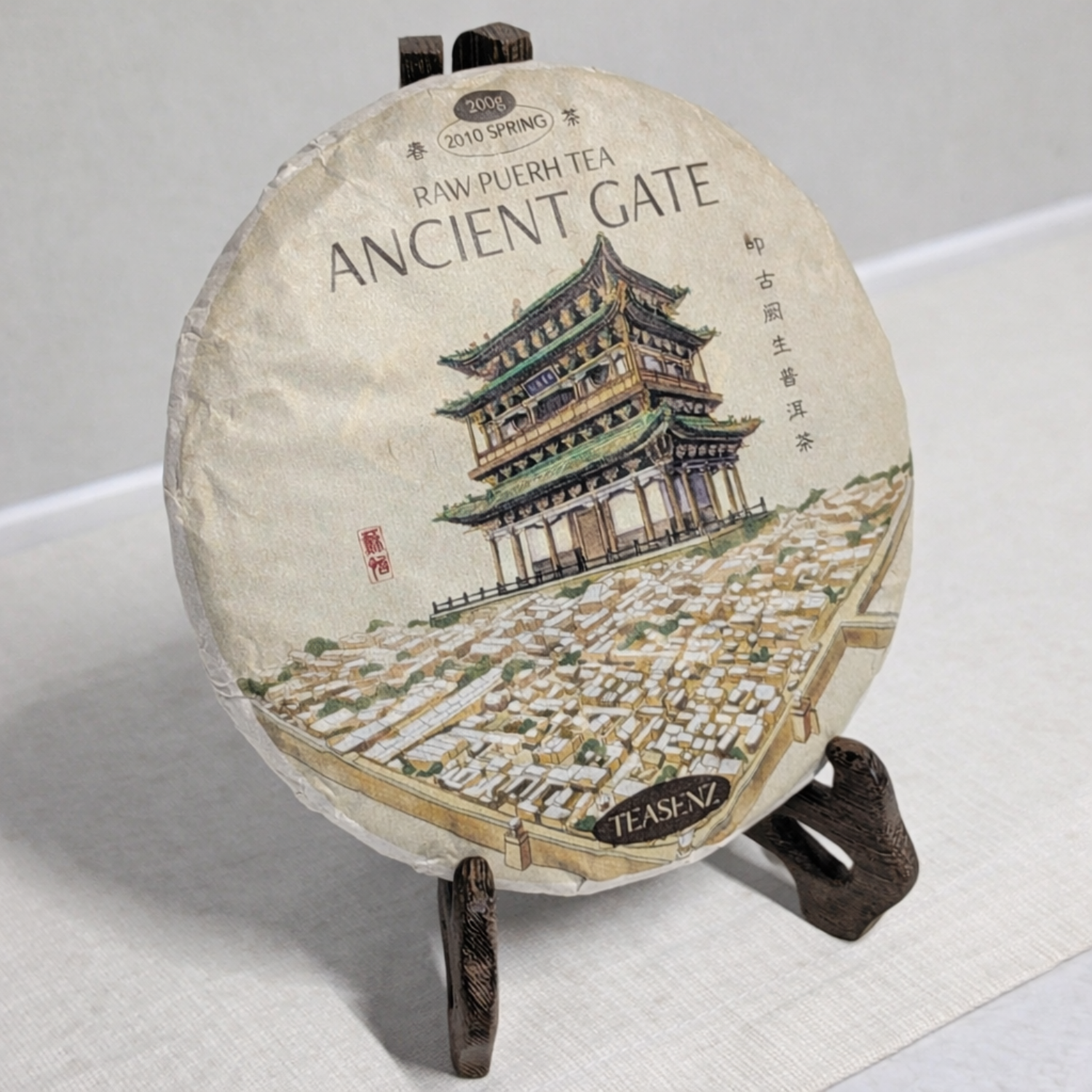 raw pu erh displayed on a wooden stand 