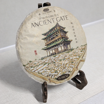 raw pu erh displayed on a wooden stand 