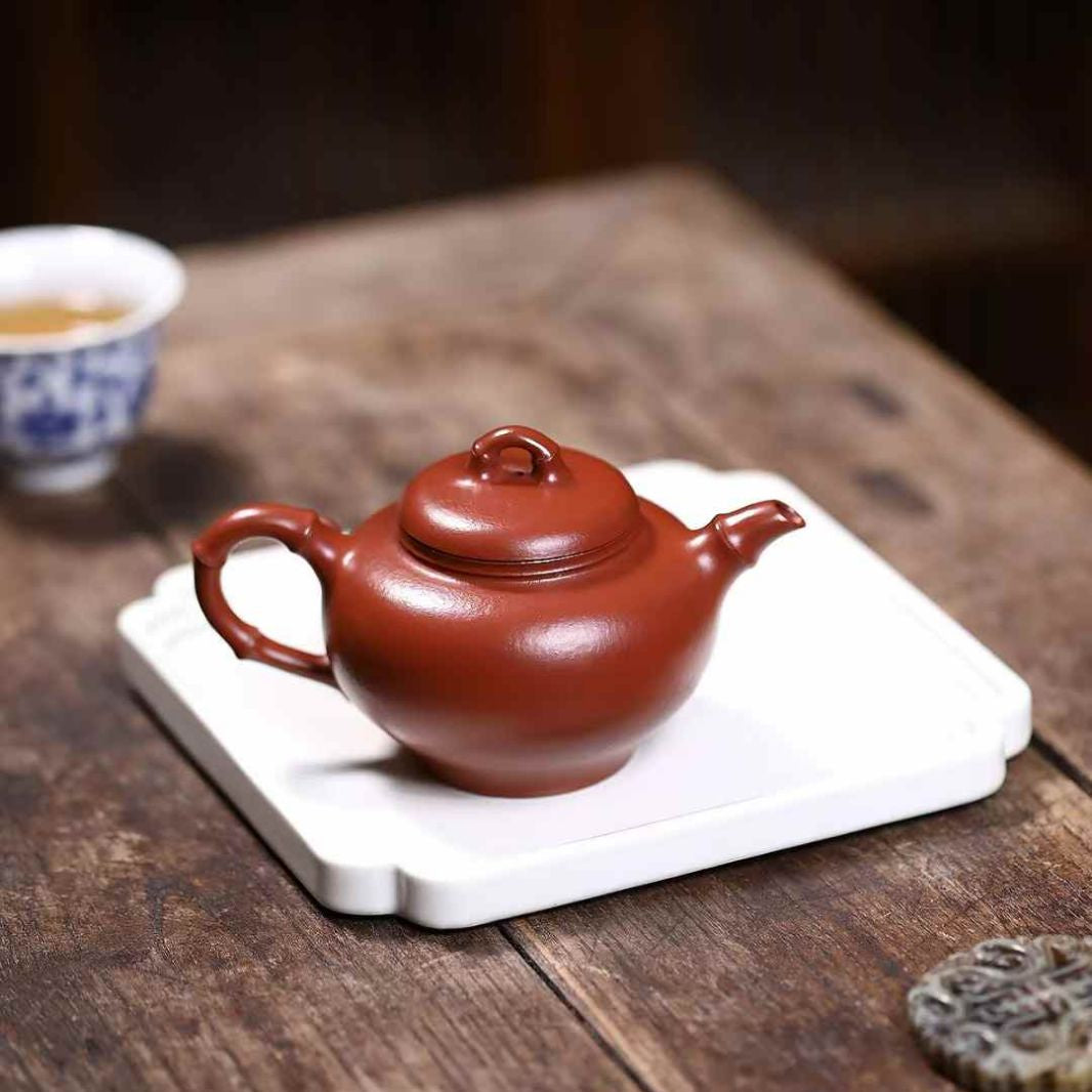 unglazed Chinese teapot displayed on a tea table