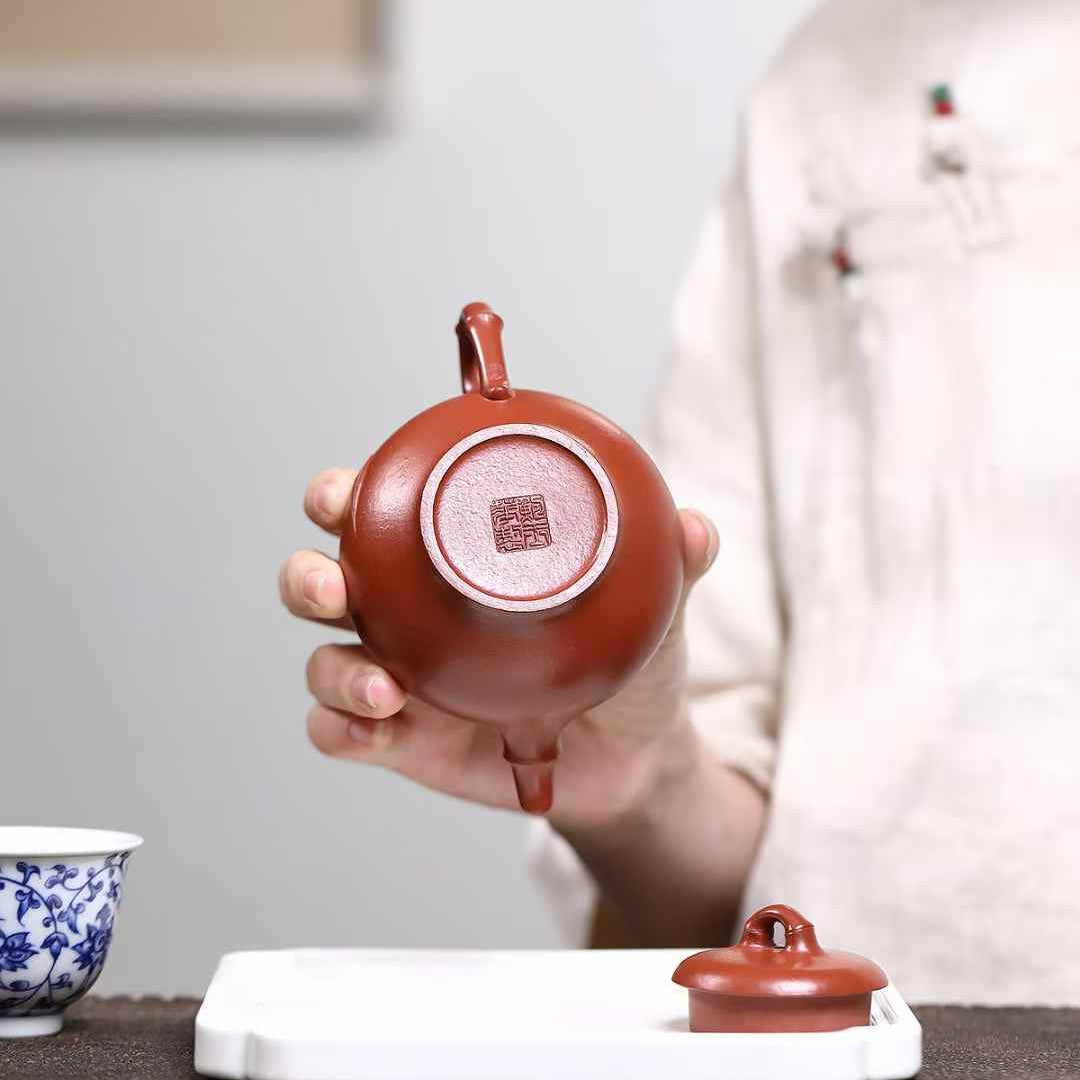 a national-level Yixing teapot artist mark stamped on their Yixing teapot